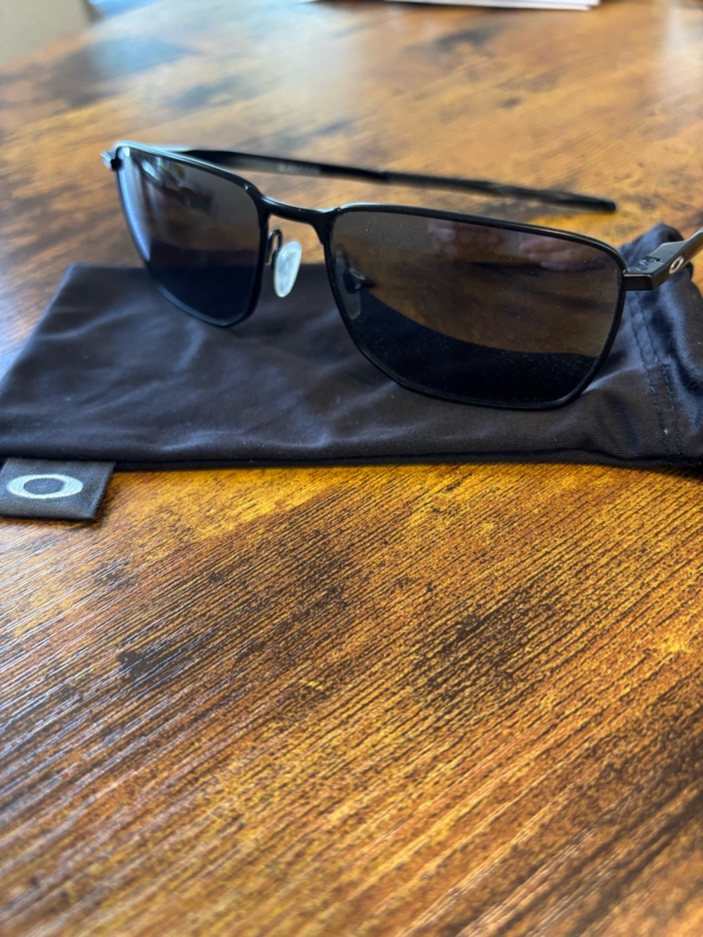 Oakley Black Metal Frame Sunglasses with Dark Lenses